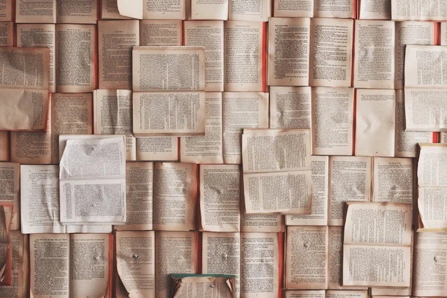 A wall of open book pages